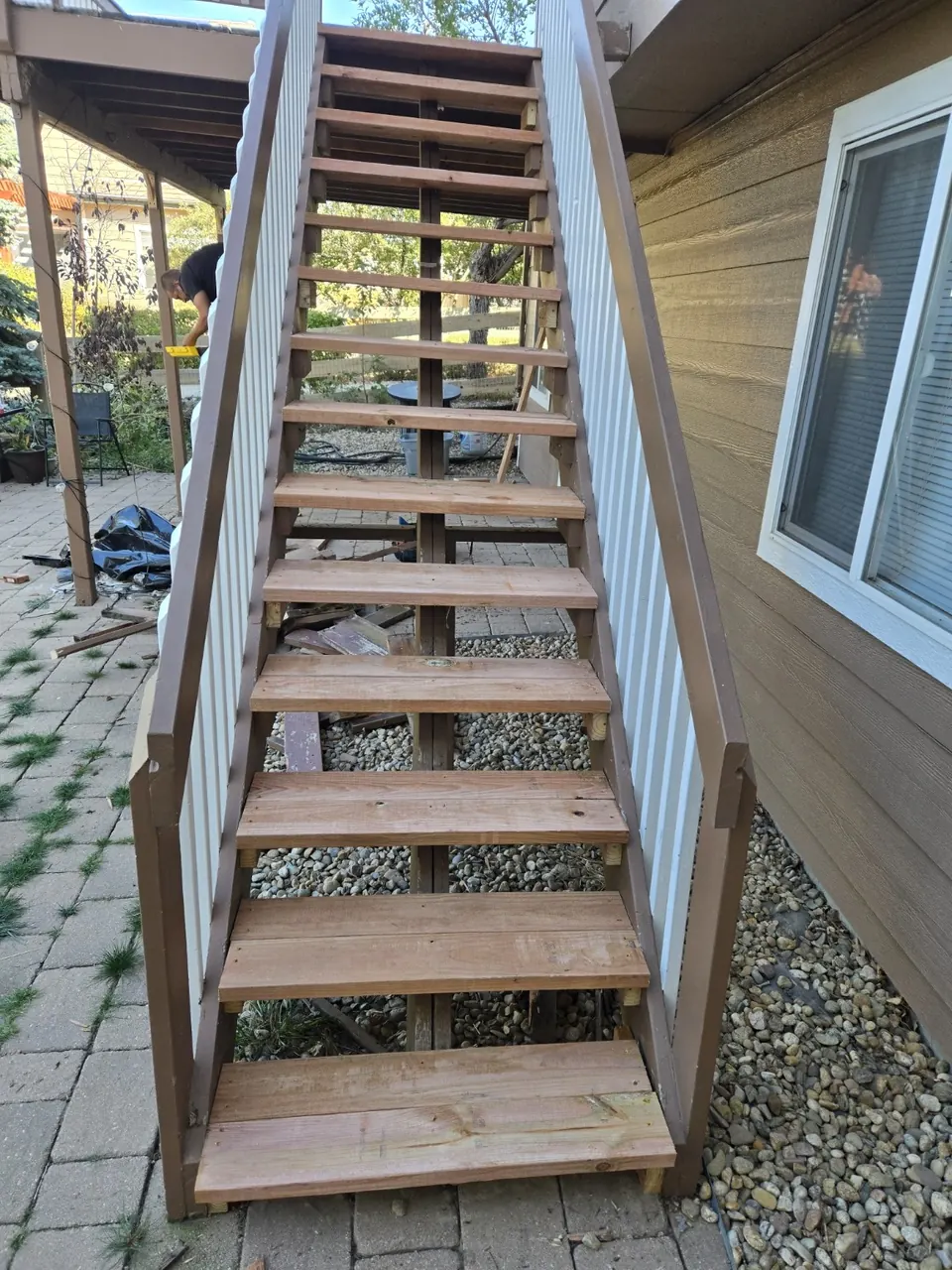 New unpainted wood stair treads installed before painting