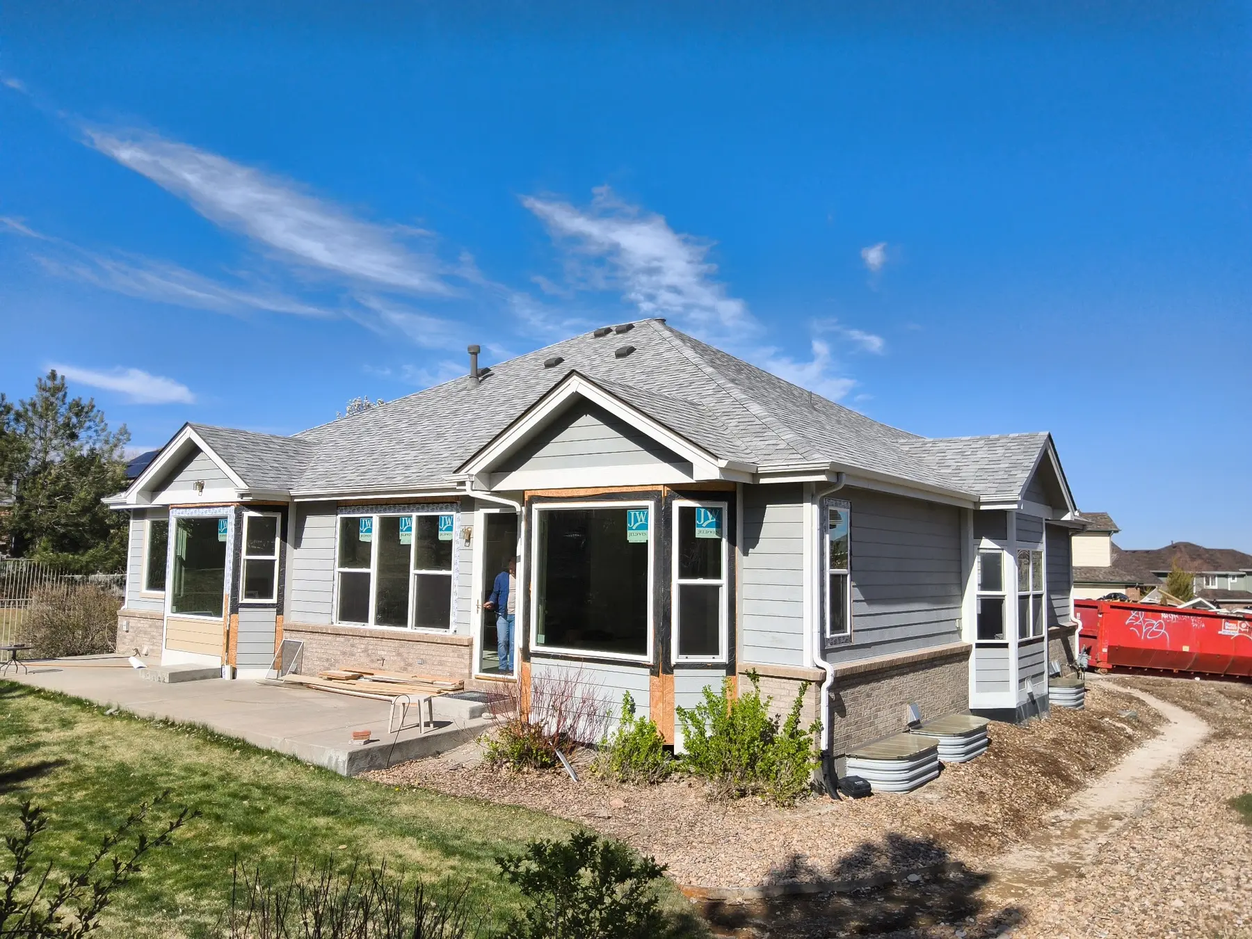 Replacement windows installed at the rear of an Aurora home before construction of the covered patio