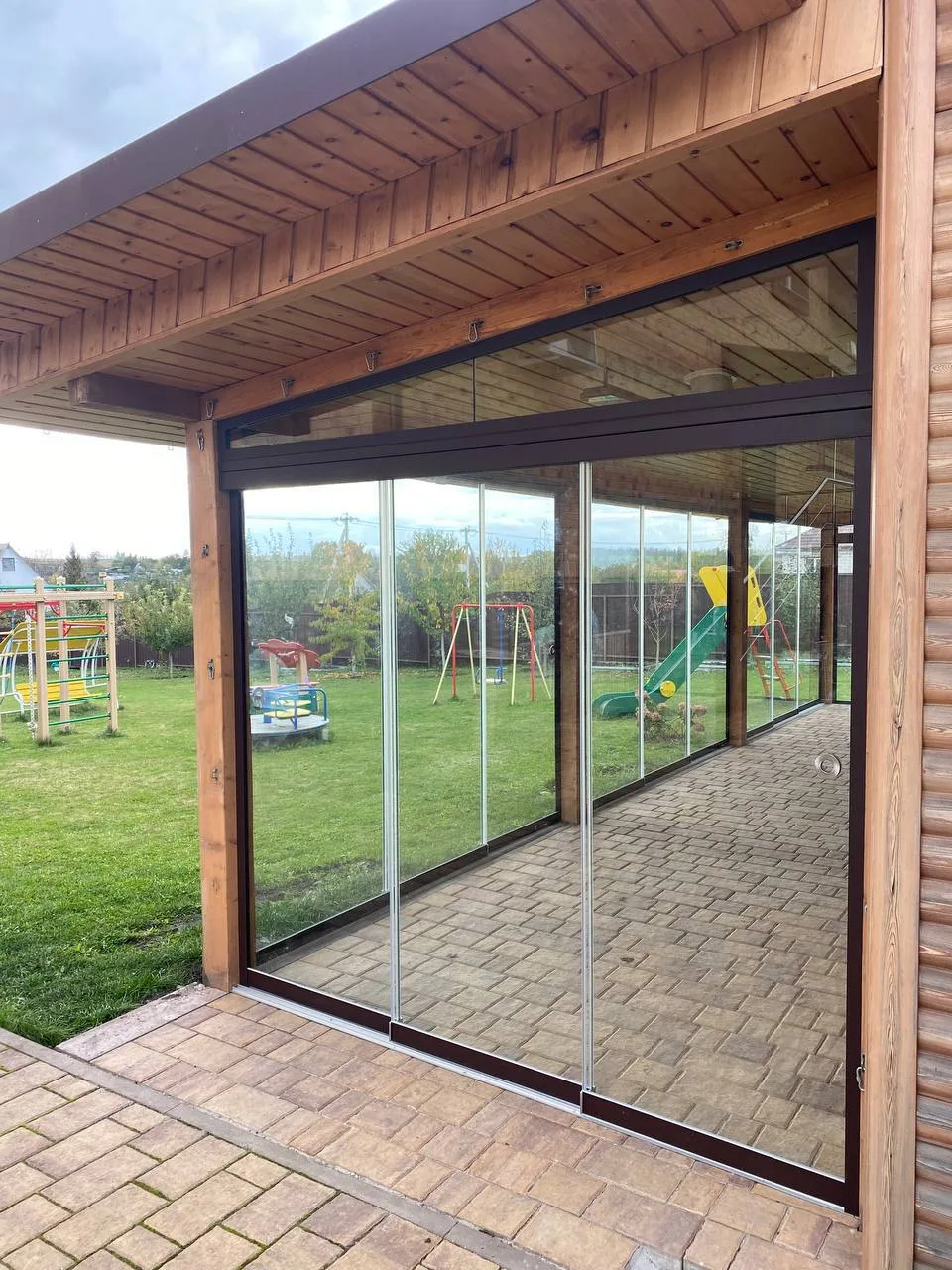 Close view of a sliding glass patio enclosure system
