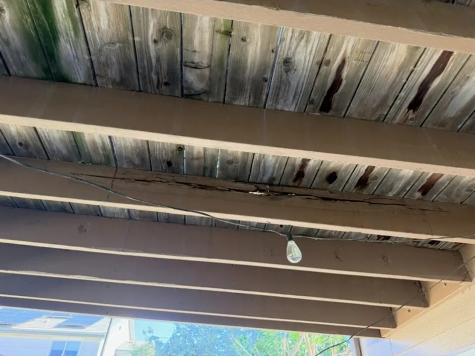 Cracked and rotten timber under the deck before repair