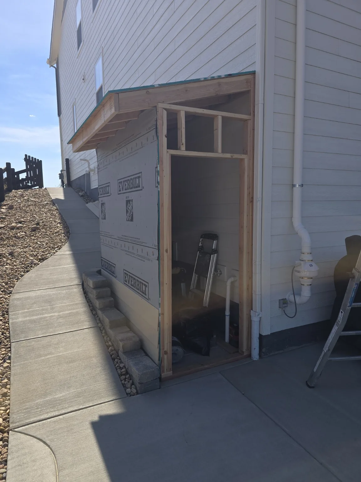 Framed door opening and header of the Castle Rock basement entrance enclosure during construction