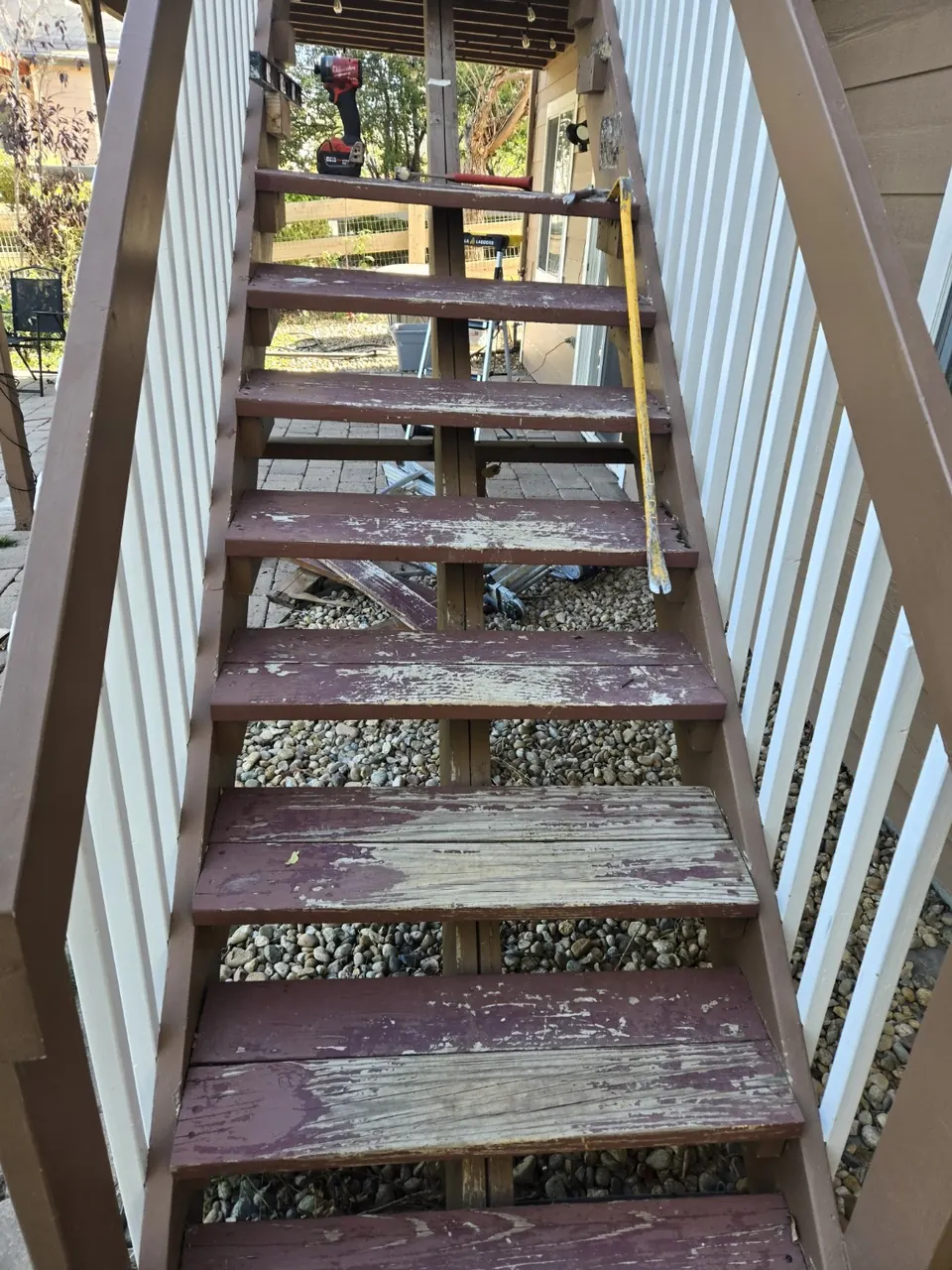 Close view of worn stair treads being replaced during the repair