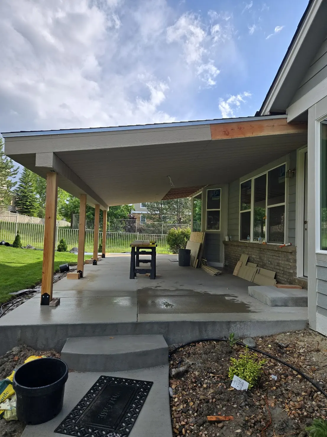 Finished soffit beneath a covered patio roof during construction in Aurora