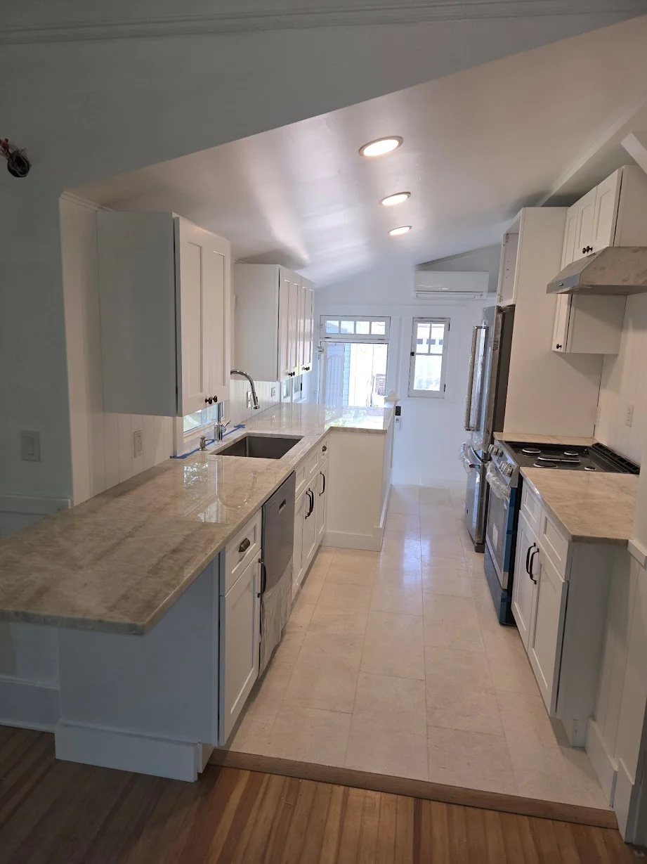 Completed white galley kitchen remodel in Denver, Colorado