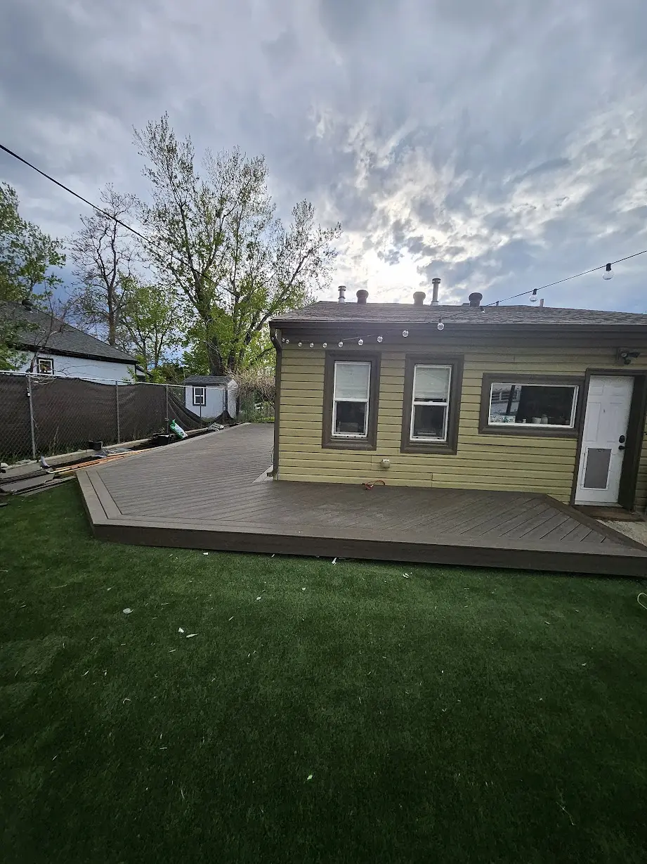 Finished wraparound Trex deck viewed from the backyard of a Littleton home